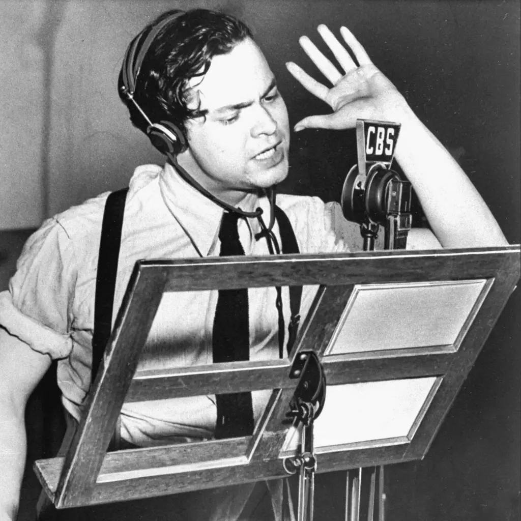 orson-welles-reading-text-of-war-of-the-worlds-by-hg-wells-during-cbs-radio-broadcast-in-october-1938