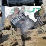 California National Guard troops prepare to board a bus for their return home after completing their assignment in Washington during the inauguration. Washington^ DC – January 22^ 2021