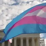 A transgender pride flag flies in front of the U.S. Supreme Court building in Washington^ DC.