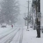 Person is walking in snow storm day on North Taylor Avein Norwalk NORWALK^ CT^ USA -FEBRUARY 7^ 2021