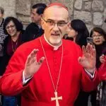 Cardinal Pierbattista Pizzaballa^ Latin Patriarch of Jerusalem^ greets the crowd as he leaves the Church of the Nativity after the Christmas celebrations. Bethlehem^ West Bank^ December 25^ 2025
