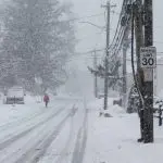 Person is walking in snow storm day on North Taylor Avein Norwalk NORWALK^ CT^ USA -FEBRUARY 7^ 2021