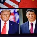 Photos of U.S. President Donald Trump and President of the People's Republic of China Xi Jinping appear on a smartphone screen. 11.04.2025. New York^ USA.