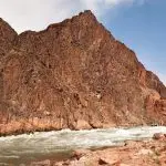 Raft approaching Granite Rapids in Grand Canyon National Park.