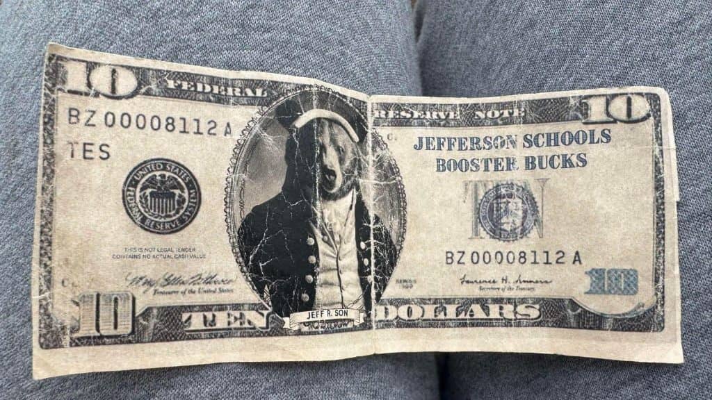 Michigan Center Football Fan Allegedly Received “Booster Bucks” Instead of Legal Tender as Change During Playoff Game