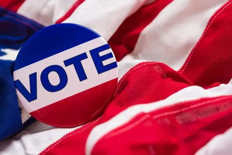 vote-button-or-pin-on-an-american-flag