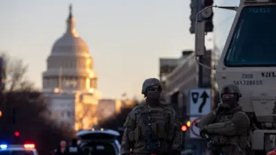 Members of the National Guard patrol the area surrounding the outskirts of the Capitol Building on January 19^ 2021^ in Washington D.C.