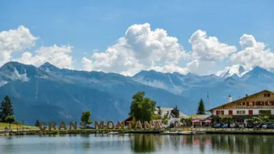 Big letters near lake spelling out Crans Montana in Switzerland during August 2020 Crans-Montana^ Switzerland - August 10^ 2020