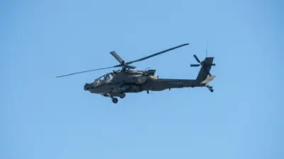 Army Apache AH-64 Helicopter during the Dragoon Ride Exercise on March 22^ 2015 in Vilnius^ Lithuania. The Boeing AH-64 Apache is a four-blade^ twin-turboshaft attack helicopter. VILNIUS - MAR 22