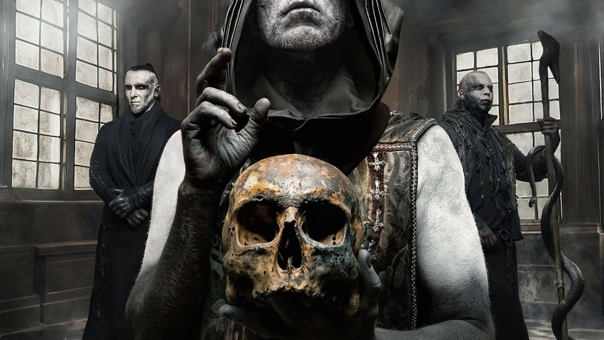 image of Behemoth to promote their upcoming tour. Man with skull in his hands and two henchman at his side.