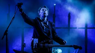 Thom Yorke of Radiohead performs on the Pyramid stage during the 2003 Glastonbury Festival being held at Worthy Farm, in Pilton, Somerset on June 28, 2003, near Glastonbury, England. The festival founded in 1970 has grown into one of the largest outdoor green field festivals in the world.