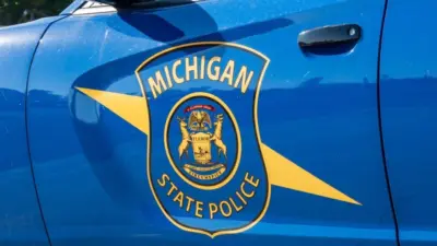State of Michigan police coat of arms on squad car Dimondale MI - June 4^ 2022
