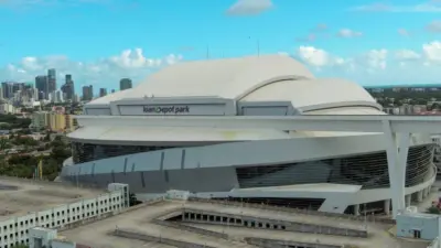 Aerial shot of LoanDepot Park with skyscrapers and office buildings in the city skyline^ lush green palm trees and cars on the street in Miami Florida USA Miami Florida USA - 11 -12-2024