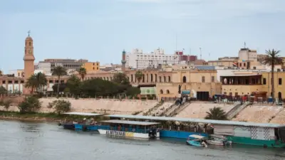 Historic buildings and riverboats on the Tigris River in Baghdad^ Iraq Baghdad^ Iraq - March 22^ 2025
