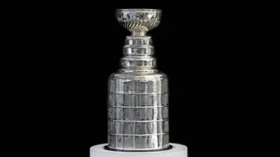 NHL ceremony - Stanley Cup trophy on the white stand^ black background^ Vancouver BC - October 22^ 2018