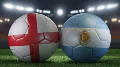Two soccer balls in flags colors on a stadium blurred background. England vs Argentina. 3D image.