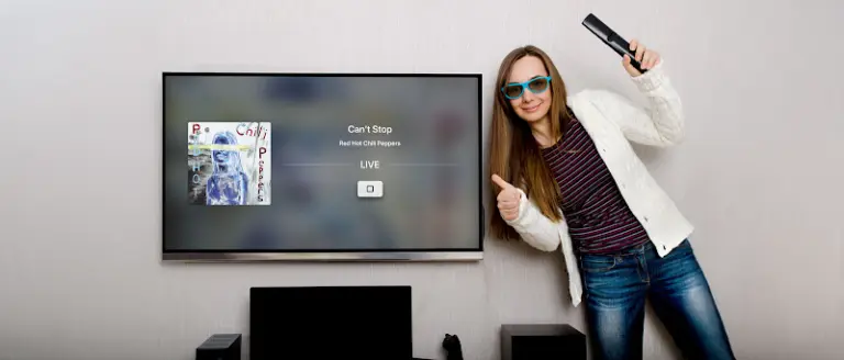 girl showing tv app with thumbs up