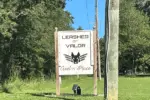 leashes-of-valor-sign