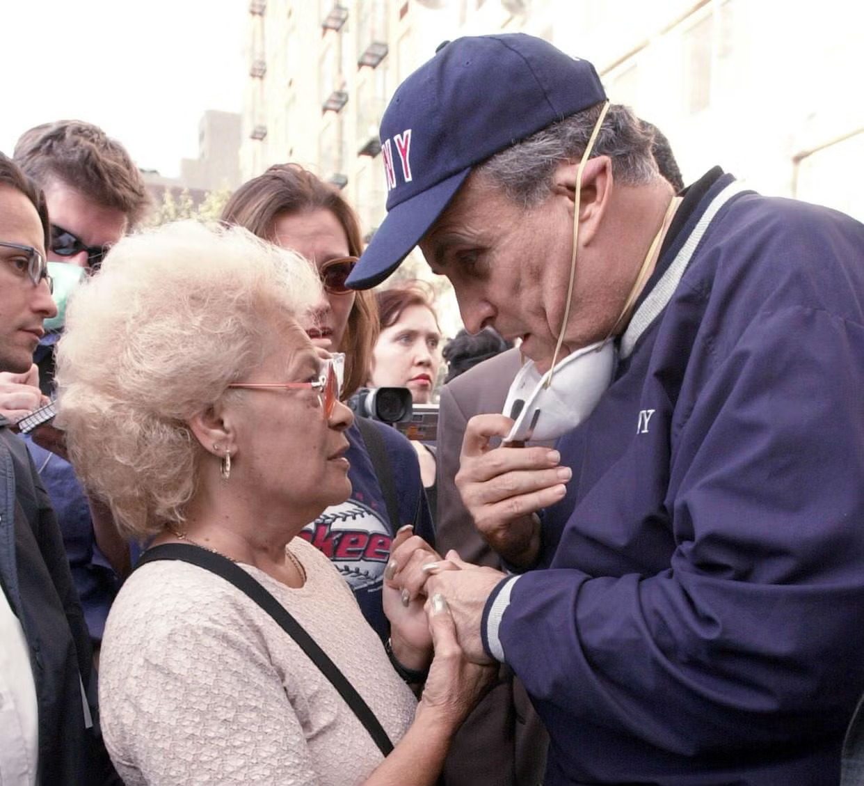 Rudy Giuliani consoling a woman after 9/11