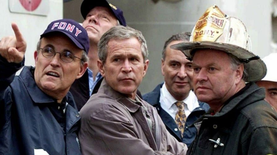 Mayor Rudy Giuliani with President George W. Bush and a firefighter in New York after the September 11 attacks