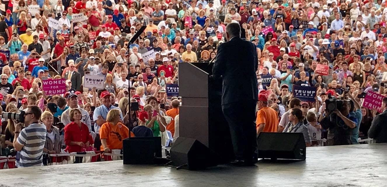 Rudy Giuliani on stage at an outdoor Trump rally