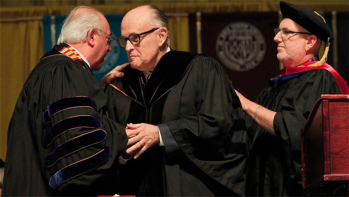 Rudy Giuliani receiving an honorary doctor of laws degree from St. John Fisher College