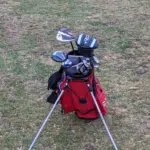 golf-bag-red-in-color-but-shot-from-the-front-of-the-bag-so-facing-the-clubs