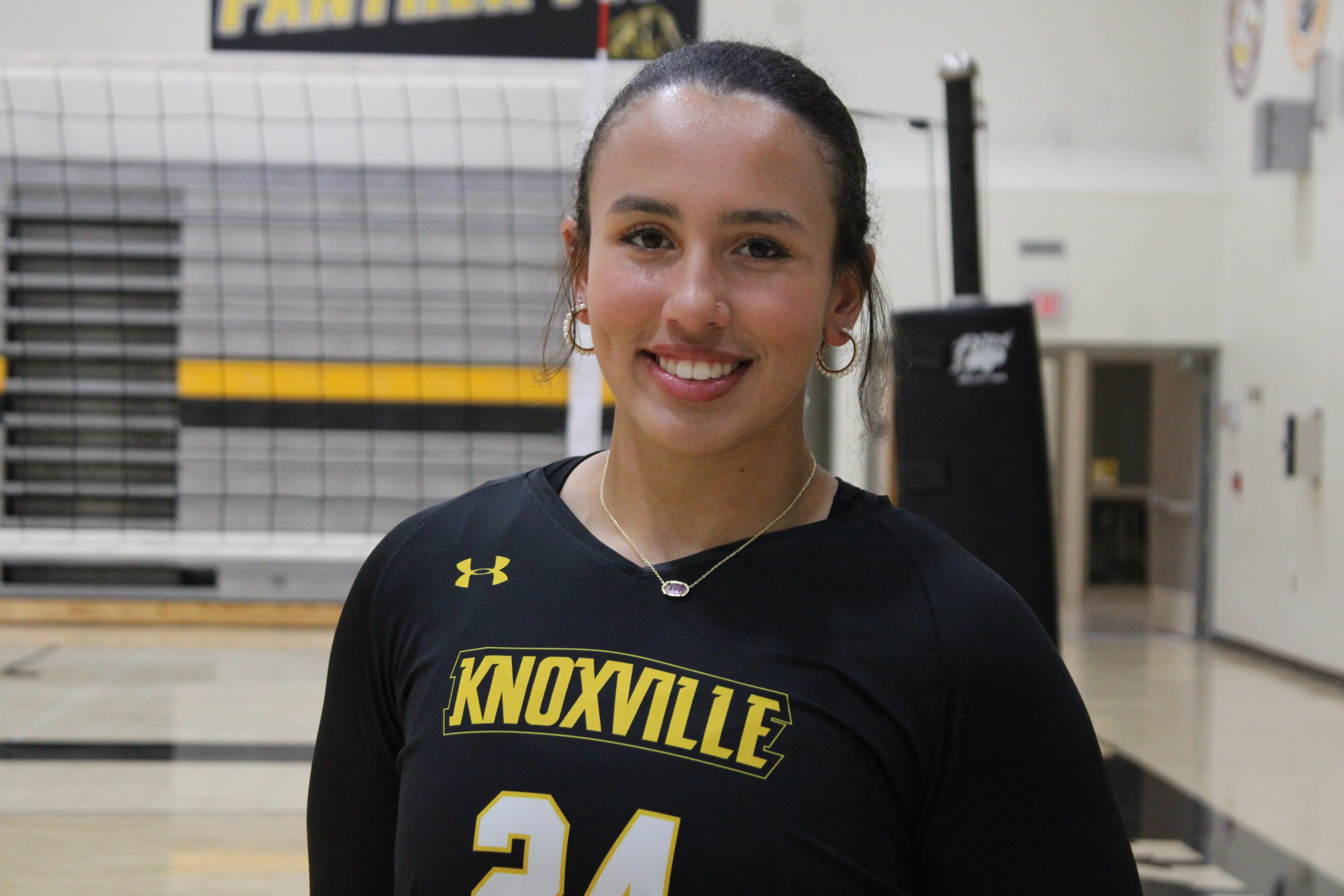 Mariah Ripperger attacking the net during the Knoxville volleyball sweeps victory
