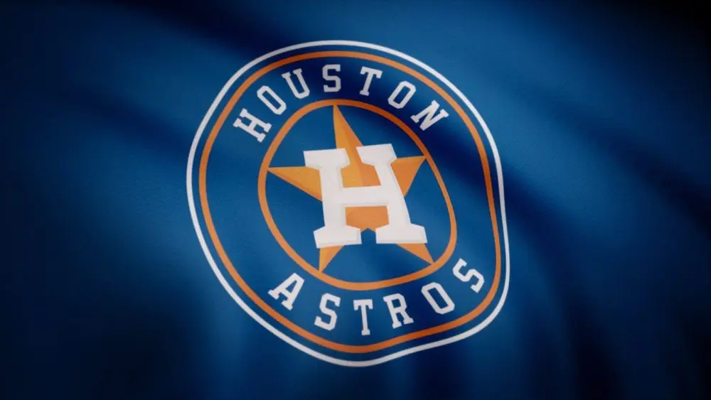 Waving flag with Houston Astros professional team logo. Close-up of waving flag with Houston Astros baseball team logo^ seamless loop. Editorial footage