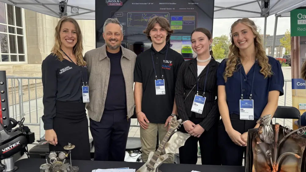St. Clair County TEC Welding instructor Becca Robertson and Welding students Brayden Fontenot, Allie Stampliss, and Rori Cowhy pose with comedian and actor Nate Bargatze during Ford ACCELERATE Sept. 30 in Detroit.
