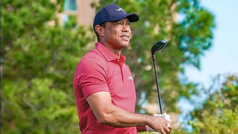 Tiger Woods watches his tee shot off the 10th hole during the final round of the PNC Championship at the Ritz-Carlton Golf Club on December 22^ 2024.