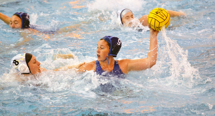 Greenwich Aquatics player, Larissa Hodzic (with ball) competes in a match at the NEZ qualifier. (photo courtesy of YMCA of Greenwich)