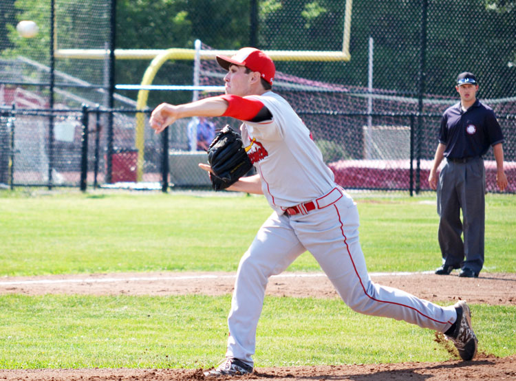 Greenwich High School senior Mike Genaro throws the ball to the plate during the CIAC class LL opening round game against Fairfield Warde High School. (Paul Silverfarb photo)