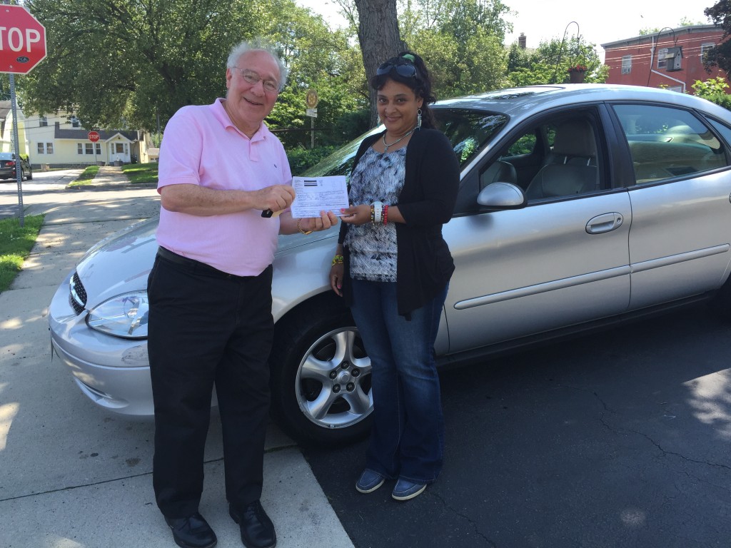Joe Kaliko presents a 2000 Ford Taurus to Veronica Correa thanks to donations from the NCH.