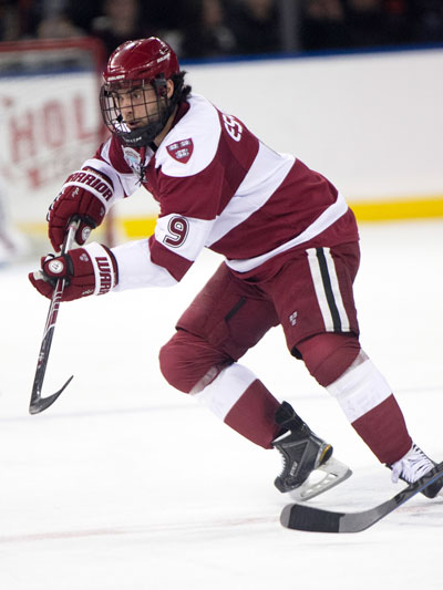 Harvard junior and Greenwich resident Luke Esposito darts down the ice during a recent game for the Crimson last year. (photo courtesy of Harvard Athletics)