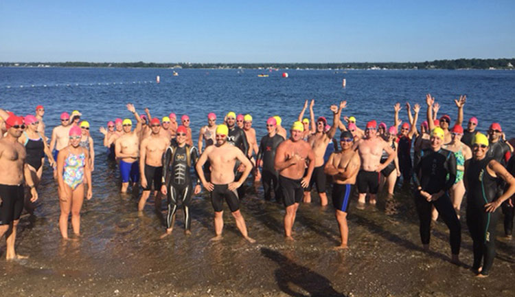 Competitors pose for a photo during the annual Island Beach 2-Mile Swim.