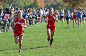 Members of the Greenwich High School girls cross-country team race towards the finish line during Wednesday's FCIAC championship held at Waveny Park in New Canaan. (Paul SIlverfarb photo)