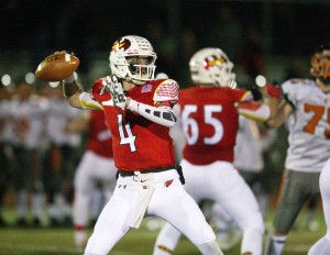 Nic Smoller drops back for a pass during Saturday's game between Greenwich and Ridgefield (John Robben Photo)