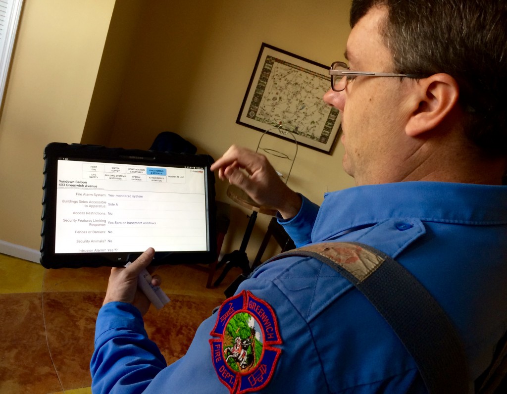 Lt. Tom Lenart demonstrates how the specialized tablets work