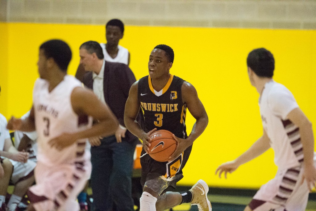 Nacho Nwana brings the ball up court in a recent game - John Ferris Robben Photo