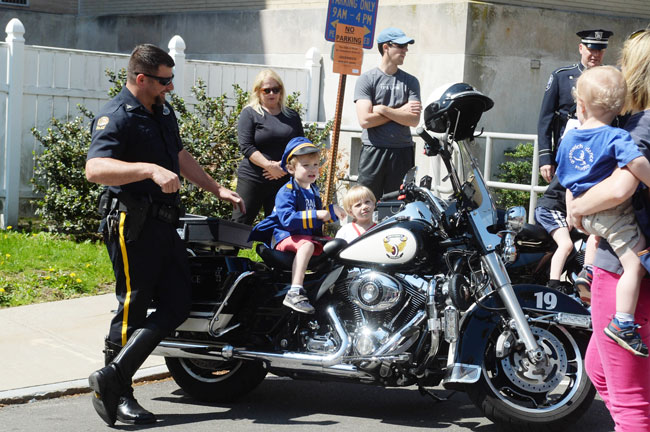 Kids hang out on officer's motorcycle