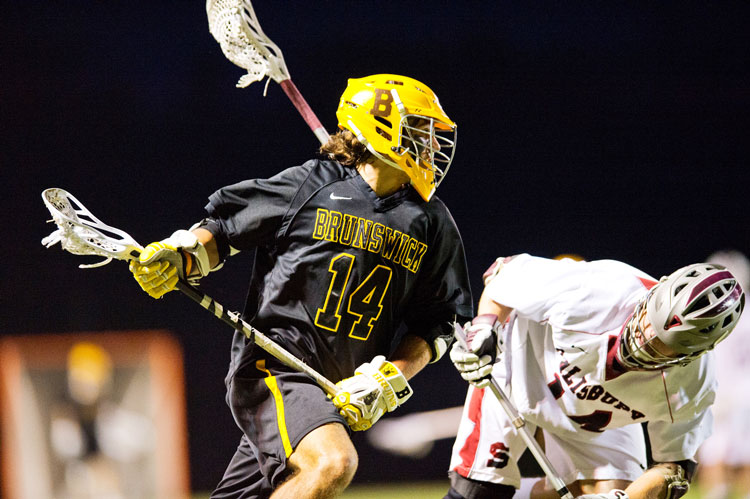 Brunswick School's Reilly Walsh looks to get past his Salisbury opponent during a recent contest.