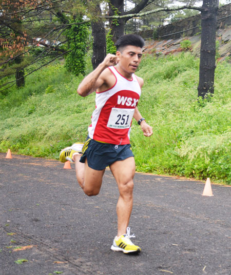 Brooklyn resident Alejandro Ariza, 26, was the overall champion during the annual Jim Fixx Memorial Day Road Race, posting a top time of 28:06. (photo courtesy of Michael Yardis / Threads and Treads)