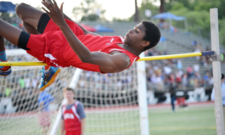 Greenwich's Safir Scott takes to the air during the high jump competition in the CIAC state open meet Monday. (Paul Silverfarb photo)