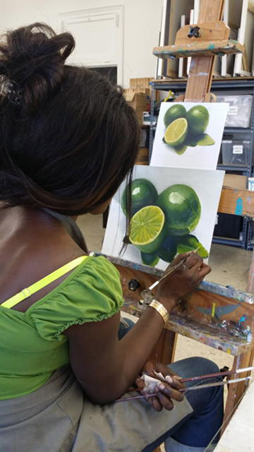 An artist works on her painting at the Greenwich Arts Society. (contributed photo)