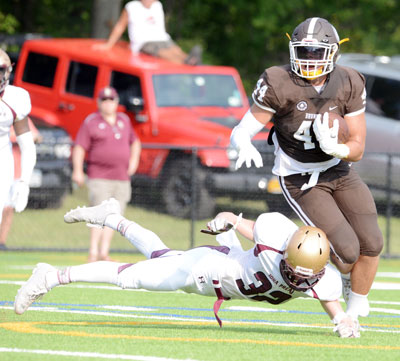 Junior Harrison Caponiti eludes the Iona Prep secondary during the second quarter Saturday afternoon. (John Ferris Robben photo)