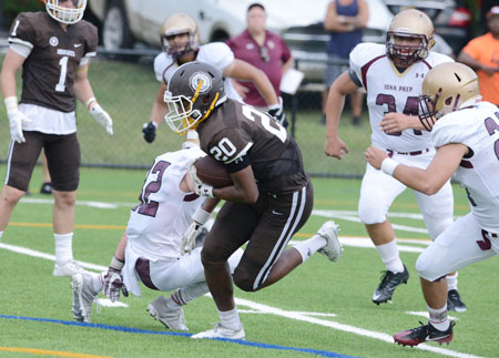 Brunswick School receiver Cornelius Johnson darts through the Iona Prep defense Saturday afternoon. (John Ferris Robben photo)