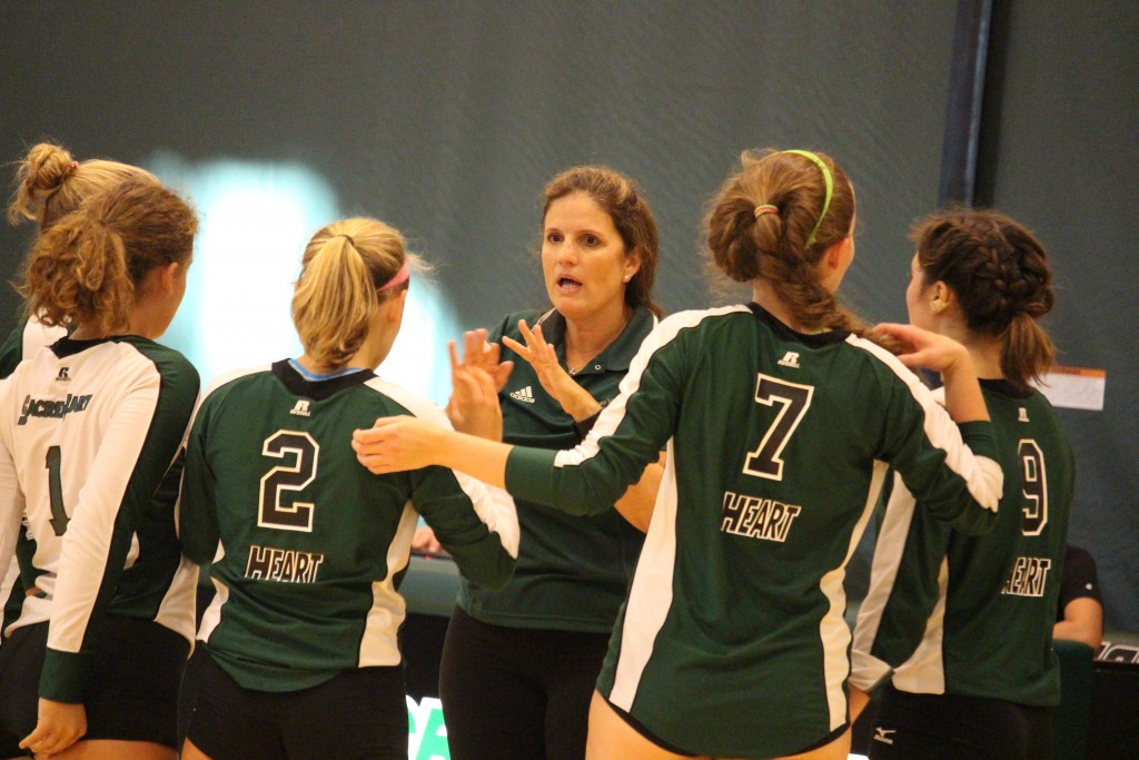 Sacred Heart Greenwich head coach Beth Wilson-Jordan chats with her team during a scrimmage Tuesday against Greenwich Academy. (Evan Triantafilidis Photo)
