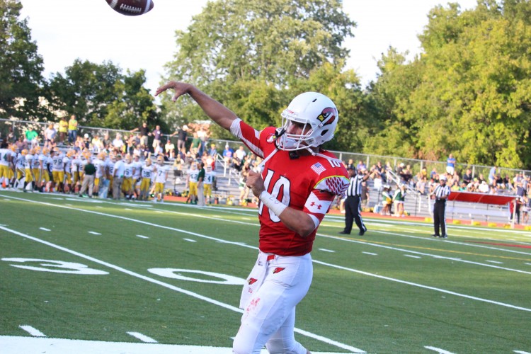 Greenwich's Connor Langan takes practice throws before Saturday's game vs Trinity Catholic