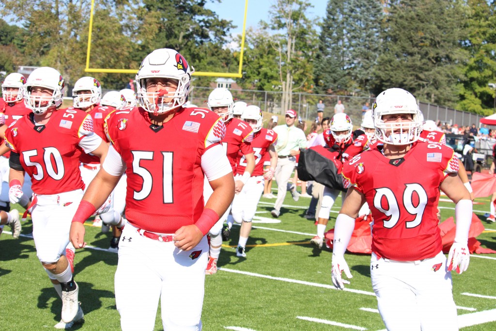 Greenwich's Ben Kraninger and Sam Colandro march out on the field before Saturday's game (Evan Triantafilidis photo)